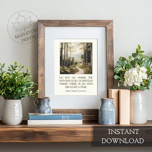May include: A printable quote by Ralph Waldo Emerson, "Do not go where the path may lead, go instead where there is no path and leave a trail." The quote is displayed on a white background with a watercolor painting of a forest path.