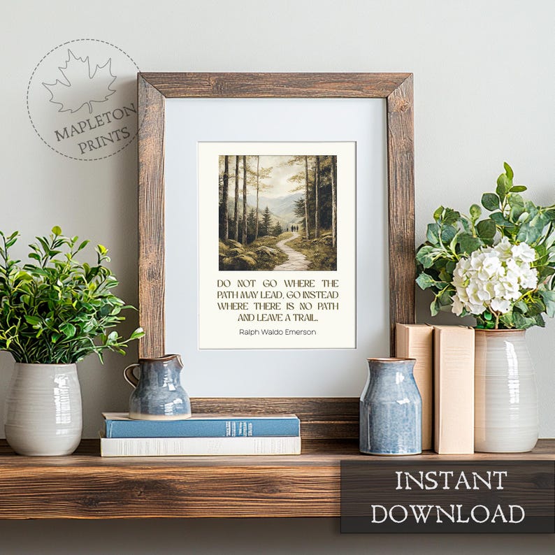 May include: A printable quote by Ralph Waldo Emerson, "Do not go where the path may lead, go instead where there is no path and leave a trail." The quote is displayed on a white background with a watercolor painting of a forest path.