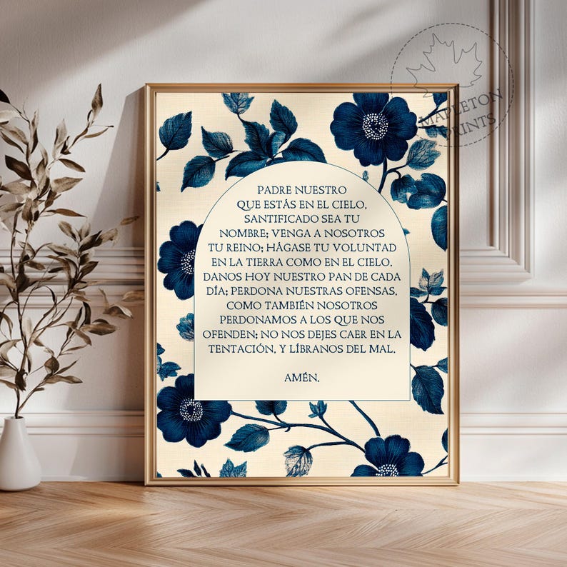 May include: A printable art print with a blue and white floral design. The print features the Lord's Prayer in Spanish, "Padre Nuestro", with a decorative arch and floral border.