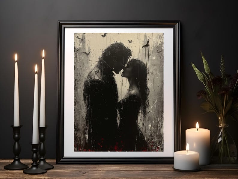 May include: A black and white painting of a couple kissing in the rain. The painting is framed in a black frame and is set against a dark background.