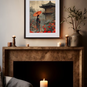 May include: A framed print depicting a woman in a traditional Japanese kimono walking through a garden with a red umbrella. The garden is filled with red flowers and a pagoda in the background.