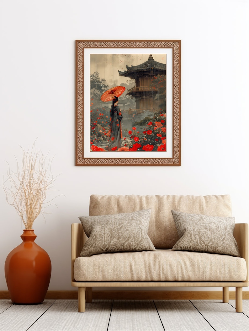 May include: A framed print depicting a woman in a traditional Japanese kimono holding a red umbrella, standing in a garden with a pagoda in the background. The garden is filled with red flowers and the sky is a soft grey.