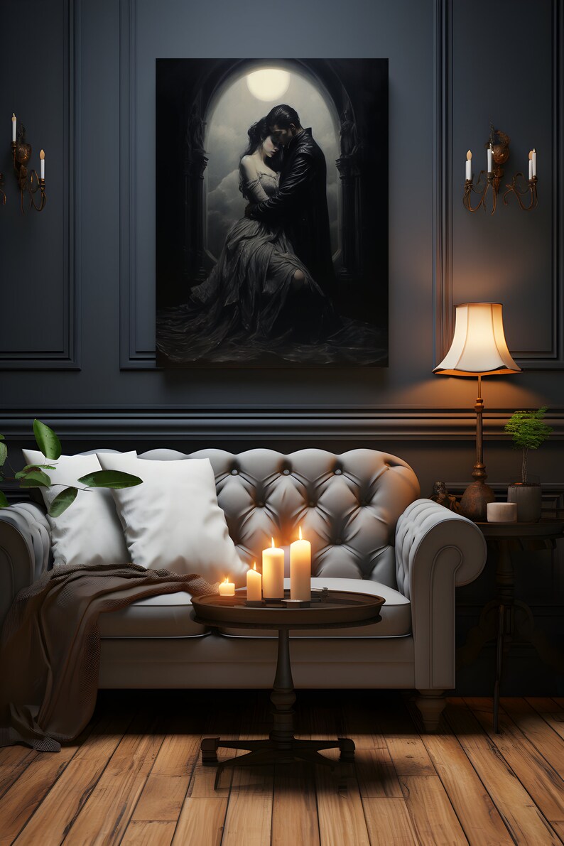 May include: A white leather sofa with two pillows and a brown throw blanket. A small round table with four lit candles sits in front of the sofa. A painting of a couple embracing under a moonlit archway hangs on the wall behind the sofa.