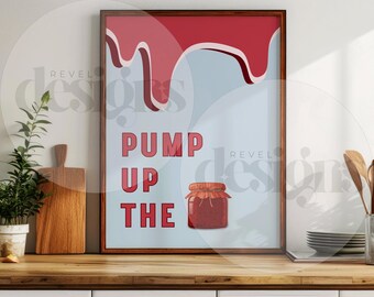 May include: A framed print with a blue background and red dripping paint. The print features the text "Pump Up The" and a jar of red jam.
