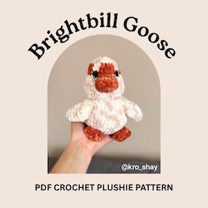 May include: A handmade crochet plushie goose with a white and light brown body, orange beak and feet, and green eyes. The text "Brightbill Goose" arches above the goose, and the text "PDF CROCHET PLUSHIE PATTERN" is below.