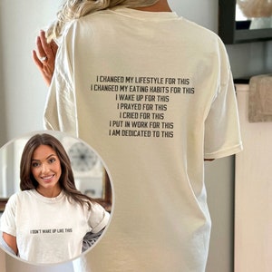 May include: White t-shirt with black text that reads "I changed my lifestyle for this, I changed my eating habits for this, I wake up for this, I prayed for this, I cried for this, I put in work for this, I am dedicated to this".