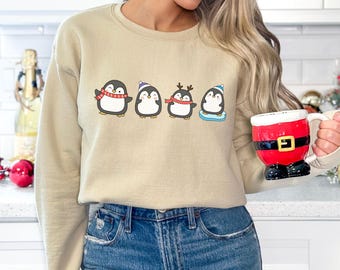 ペンギンのメリークリスマススウェットシャツ、かわいいペンギンのクリスマスライトセーター、クリスマスペンギン好きのためのシャツ、クリスマスギフト、動物好きへのギフト
