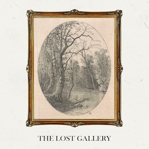 May include: A framed black and white drawing of a forest scene with trees and a river. The drawing is in an oval shape and is framed in a gold frame. The text "THE LOST GALLERY" is below the frame.