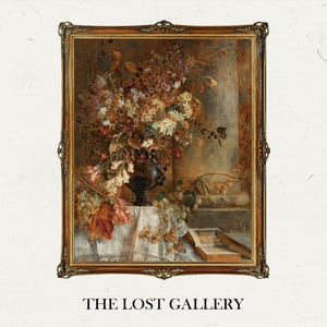May include: A framed oil painting depicting a still life with a vase of flowers, grapes, and a book. The flowers are a mixture of white, pink, and yellow, and the vase is a dark brown colour. The painting is set against a light brown background.