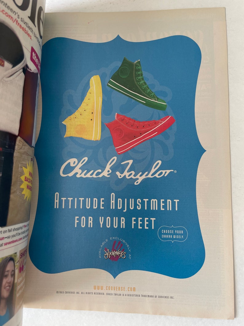 May include: A vintage-style advertisement for Chuck Taylor sneakers featuring three pairs of high-top sneakers in yellow, red, and green. The ad text reads "Attitude Adjustment for Your Feet" and "Choose Your Chuck Wisely". The ad also states that the sneakers are available exclusively at Journeys.