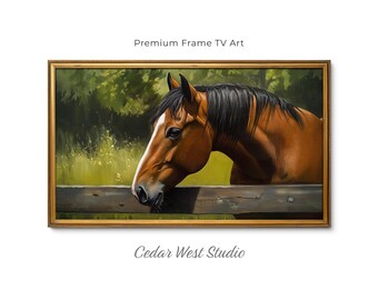 May include: A rectangular wall art piece featuring a brown horse with a black mane resting its head on a wooden fence, set against a green meadow background. The artwork is enclosed in a gold-toned frame with the text Premium Frame TV Art and Cedar West Studio.