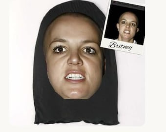 Rolig specialdesignad kändisskämtmask med titeln "It's Britney Bit"** Britney Spears paraply-eran parodimask – rakat huvud, ilsket ansikte (3D-partymask)