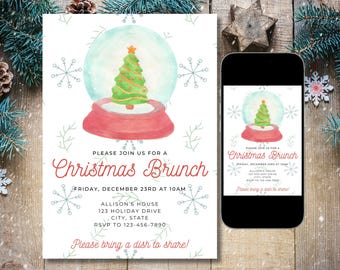May include: A Christmas Brunch invitation featuring a watercolor snow globe with a green Christmas tree. The invitation includes the text "Please join us for a Christmas Brunch" and event details. The invitation is displayed on a wooden surface.