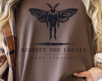 May include: A brown sweatshirt with a black moth graphic and the text "Respect the Locals West Virginia".