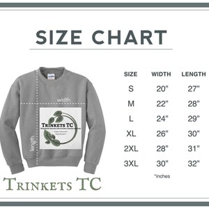 May include: Gray sweatshirt with a logo that says "TRINKETS TC" and the text "Handmade Nature and Science Themed Jewelry". The sweatshirt has a size chart with measurements in inches.