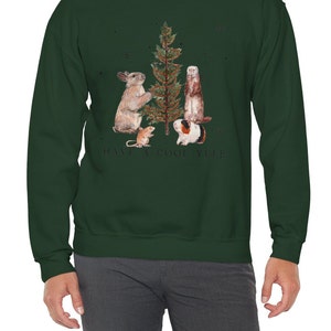 May include: A dark green sweatshirt with a Christmas tree and four animals decorating it. The text "HAVE A COOL YULE" is printed below the tree.