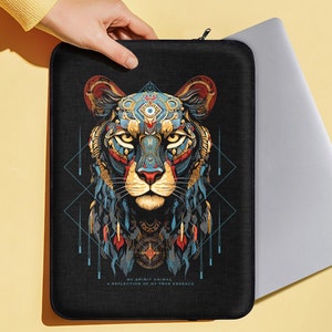 May include: Black laptop sleeve with a colorful graphic of a stylized animal head with geometric patterns and the text "My Spirit Animal A Reflection of My True Essence".