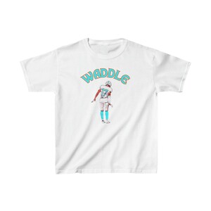 May include: White t-shirt with a teal and orange graphic of a football player with the text "WADDLE" above the player.