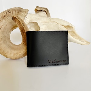ORTHROS: Cartera de cuero óptico plegable