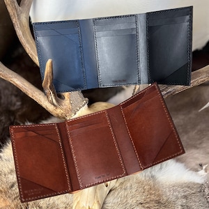 CERBERUS: Cartera de piel óptica