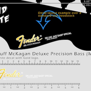 Op de afbeelding: Zwarte headstock-sticker voor een Duff McKagan Deluxe Precision Bass (MIM). De sticker heeft het Fender-logo in goud, met afmetingen van 23,00 cm (9,05 inch). Bevat de tekst "DELUXE JAZZ BASS SPECIAL MADE IN MEXICO".