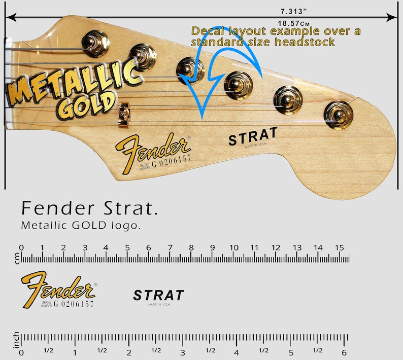 K&ouml;nnte beinhalten: Eine Gitarrenkopfplatte mit dem Fender Strat Logo in Metallic-Gold. Die Kopfplatte ist hellbraun mit goldenen Stimmwirbeln. Das Bild enth&auml;lt ein Lineal, das zeigt, dass die Kopfplatte 18,57 cm lang ist.