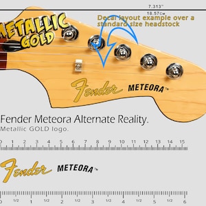 May include: A guitar headstock with the Fender Meteora logo in gold. The image includes a ruler showing the headstock is 7.313 inches wide. The text "Metallic GOLD" is also visible.