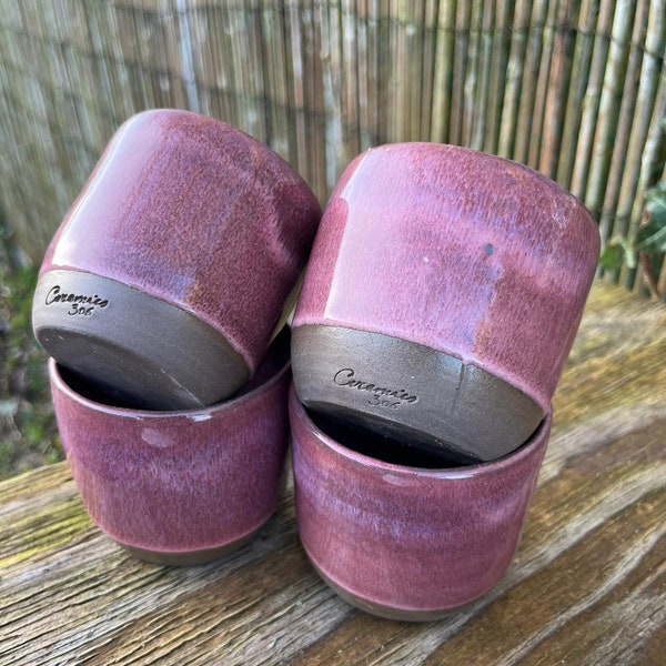 Burgundy coffee cups on anthracite clay