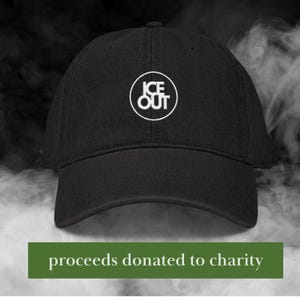 May include: Black baseball cap with a white embroidered "ICE OUT" logo in a circle. The text "proceeds donated to charity" is displayed on a green banner at the bottom of the image. The cap is a classic six-panel design.