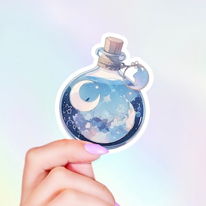 May include: A blue glass bottle with a cork stopper and a white tag. The bottle is filled with a blue liquid and contains a crescent moon, stars, and clouds. The bottle is surrounded by a white border.