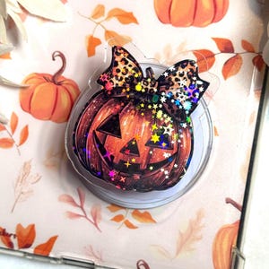 Pumpkin Bow Holographic Kindle Grip – Halloween Jack-O’-Lantern MagSafe Phone & Tablet Stand