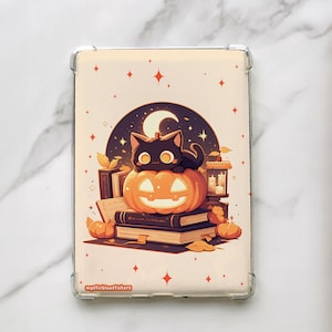 May include: A black cat sits on top of a jack-o'-lantern with a stack of books and a small lantern beside it. The background is a dark blue with stars and a crescent moon. The image has a vintage aesthetic.