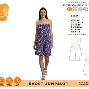 May include: A woman models a blue floral print short jumpsuit. The strapless jumpsuit has a fitted bodice and wide legs. The image includes the text "SHORT JUMPSUIT" and size information for US, UK, EU, AU, and JP sizes.
