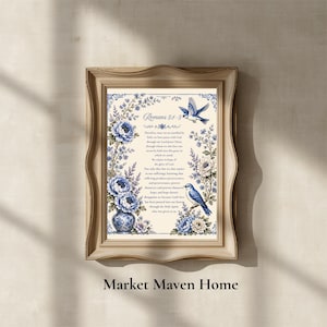 May include: A framed wall art print featuring the text of Romans 5:1-5 in a dark blue serif font. The design includes blue and white floral illustrations, a blue and white vase, and two blue birds, all set against a cream-colored background.