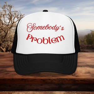 Somebody&#39;s Problem Trucker Hat: Funny Embroidered Sarcastic Cap