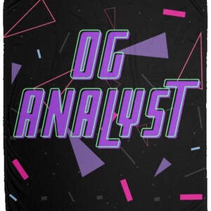 May include: A black throw blanket with a purple and green design that says "OG ANALYST" with a retro 80s style geometric pattern.