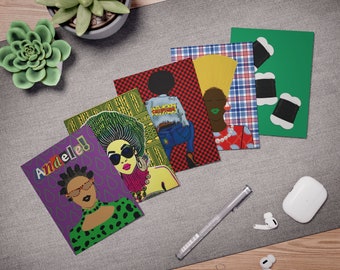 May include: Set of six greeting cards featuring colorful illustrations of women with different hairstyles and clothing. The cards have a variety of patterns and designs, including plaid, checkered, and floral. The text "Andele!" is written on one of the cards.