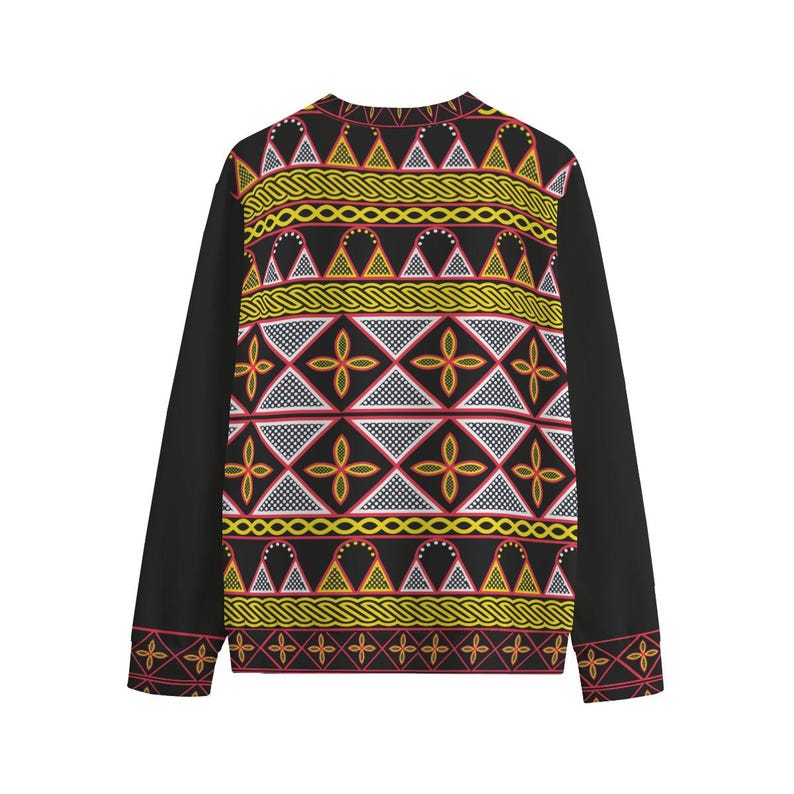 May include: Black long-sleeve shirt with a vibrant geometric pattern on the front and upper back. The pattern features yellow, red, and white shapes, including triangles, diamonds, and floral designs. The sleeves are solid black.