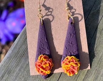 Vintage marigold yellow and orange flowers purple vintage textured base clay earrings día de los muertos day of the dead