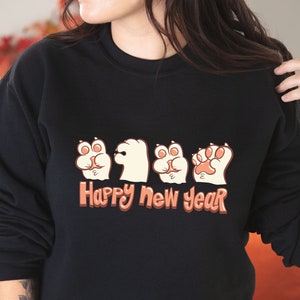 Funny Happy New Year 2024 Sweatshirt Cute Paw Hand Signs for New Year Shirt Funny Cat Paw Winter Sweatshirt Gift for Cat Lovers