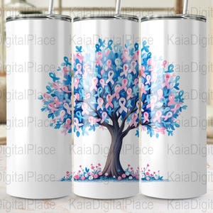 May include: White tumbler featuring a tree design with blue and pink ribbons, flowers, and leaves. The tree trunk is brown, and the ribbons are in the shape of awareness ribbons. The tumbler has a silver lid and straw.