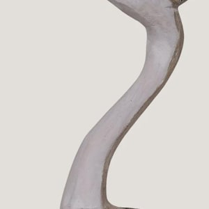 Tall wooden crane bird