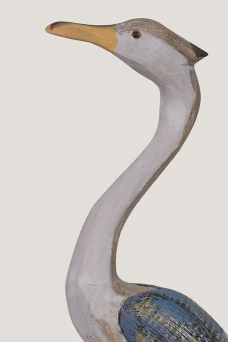 Tall wooden crane bird