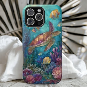 May include: A phone case featuring an underwater scene with a sea turtle, colorful fish, and coral. The case has a blue and green background with a detailed illustration of marine life. The design wraps around the edges of the phone.