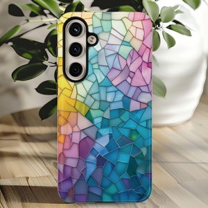 May include: A colorful phone case with a stained glass design. The case has a mosaic pattern with shades of blue, purple, yellow, and green.