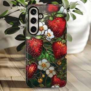 May include: A phone case with a stained glass design featuring red strawberries, white flowers, and green leaves.