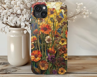 Puede incluir: Una funda de teléfono colorida con un diseño de vitral que presenta una variedad de flores en tonos de amarillo, naranja, rojo y morado. La funda tiene un borde negro y una parte posterior transparente.