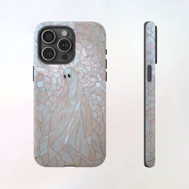 May include: A white iPhone case with a ghost design on a pearlescent background. The case has a mosaic pattern and a black border.