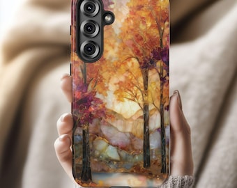 May include: A phone case featuring an autumn landscape design. The case displays a watercolor painting of trees with orange, red, and yellow leaves. The background shows mountains and a sunset. The case has a black camera module.