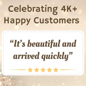 May include: A white card with a brown border and text that reads "It's beautiful and arrived quickly." There are five gold stars below the text.